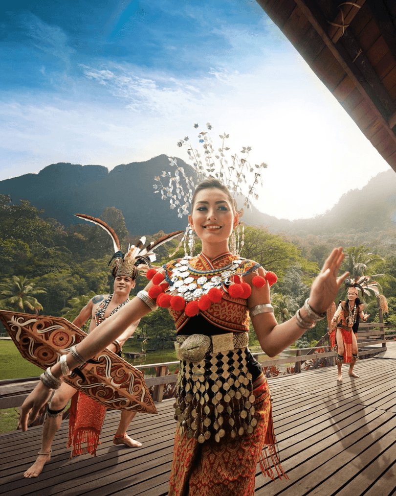 Traditional Malaysian cultural dancers performing outdoors