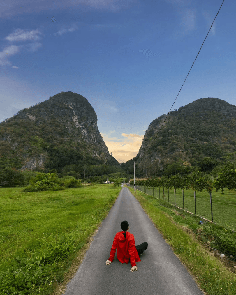 Quiet road between limestone hills in rural Malaysia