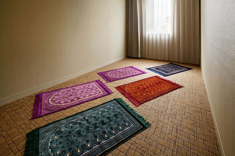 Prayer mats prepared in a quiet Muslim-friendly space